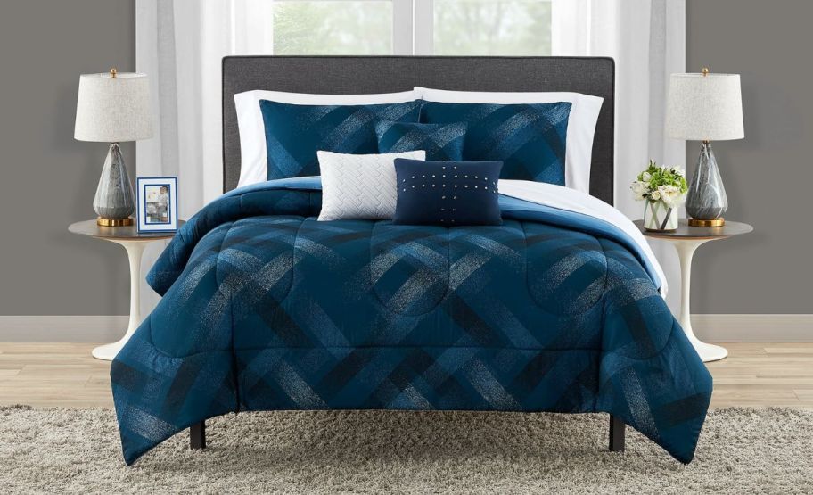 a bed featuring a blue plaid 10piece bed in a bag set