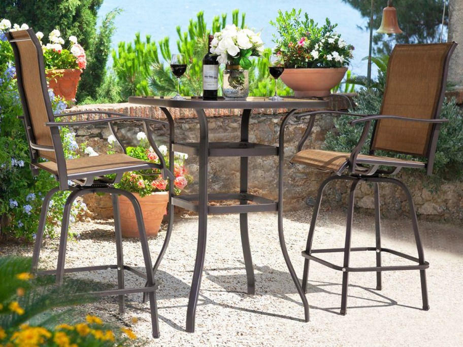 two brown patio bistro chairs and table in garden