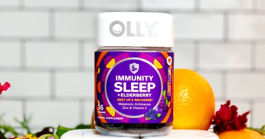 bottle of OLLY Immunity Sleep near oranges in kitchen