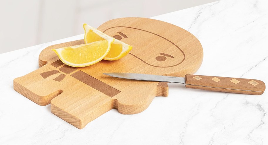 sliced lemons and knife on top of a ninja cutting board