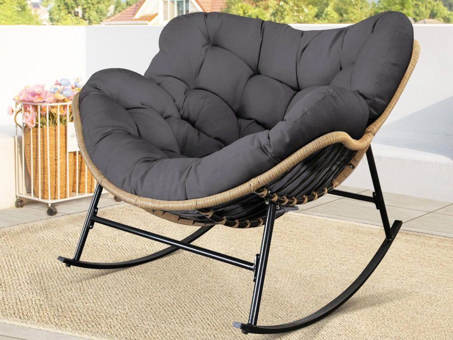 grey rocking papasan chair on patio