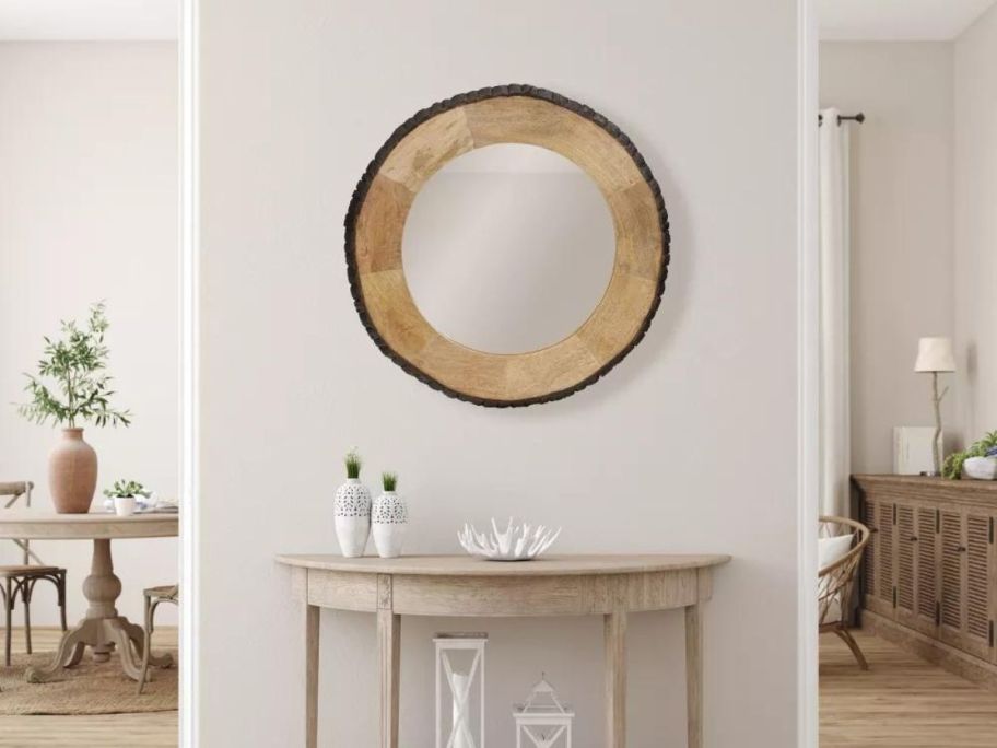 River of Goods 30.5" Ashley Wood & Glass Wall Mirror in hallway above table