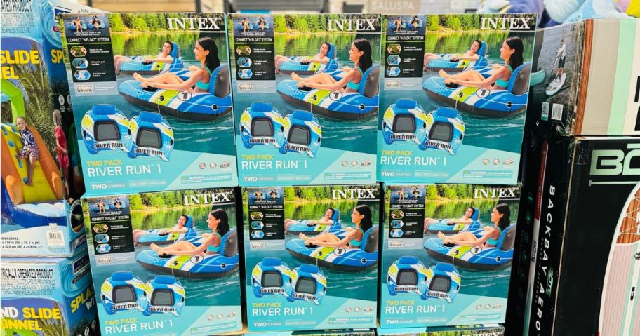 Several boxes of Sam's Club Intex River Run 2-Pack