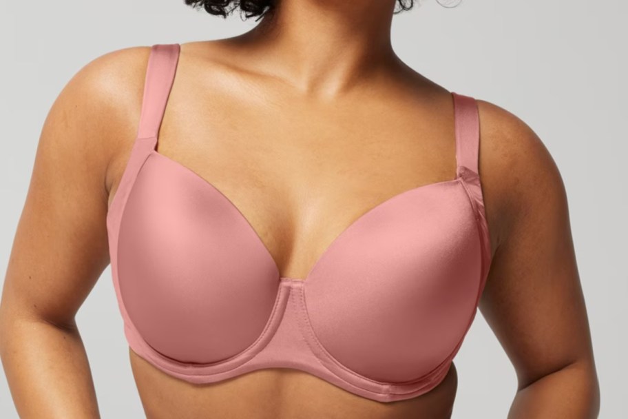 woman in pink smoothing bra