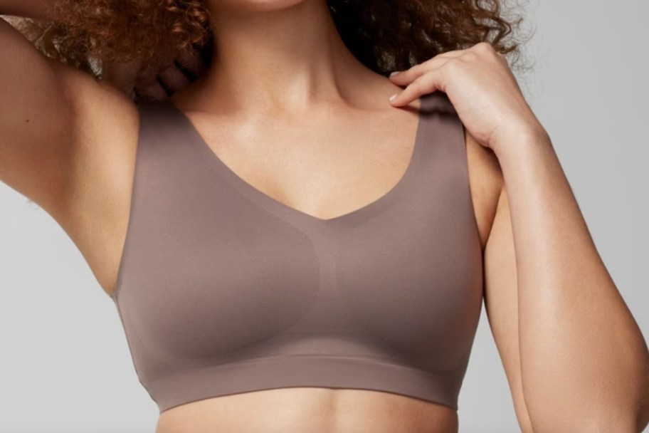 woman in coffee brown sports bra