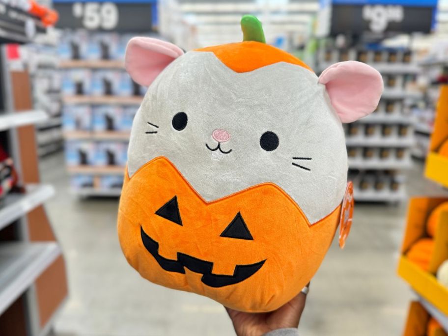 Squishmallows 12" Milto the Grey Mouse in Jack-O-Lantern in hand in store