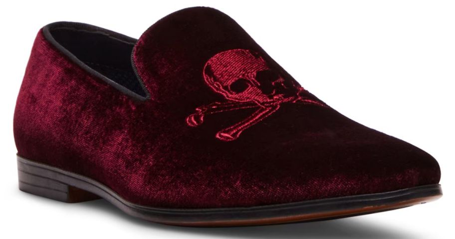 A red velvet shoe with a skull on it