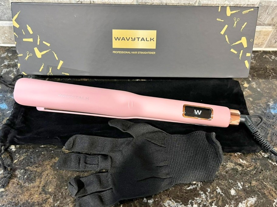 pink flat iron in box with heat resistant glove