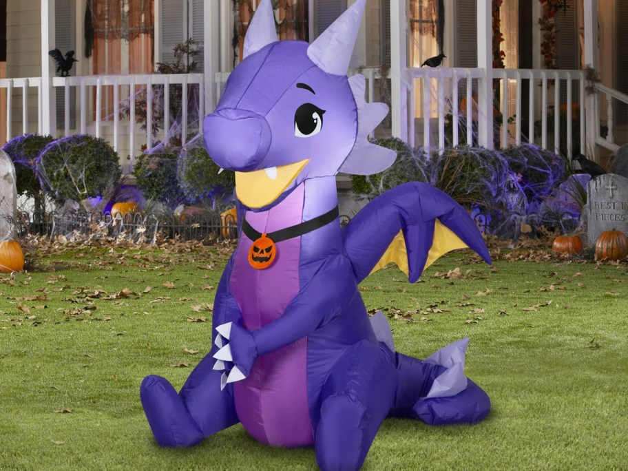 purple dragon halloween inflatable in yard