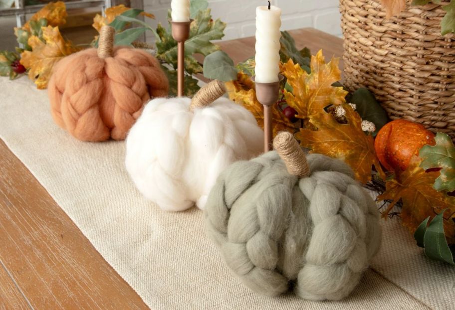 wool braided pumpkins on a mantle