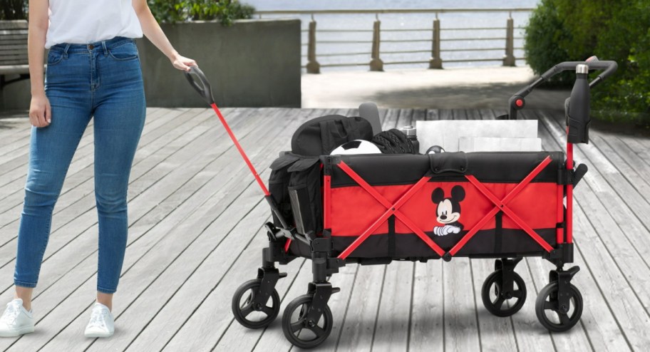 Woman holding Disney stroller wagon