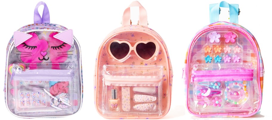 three clear mini backpacks with accessories inside