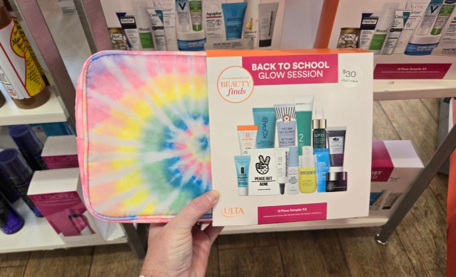 a womans hand holding a back to school glow session kit