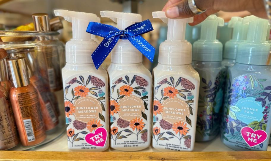 three bottles of sunflower meadows foaming handsoap on display in a bath and bodyworks store