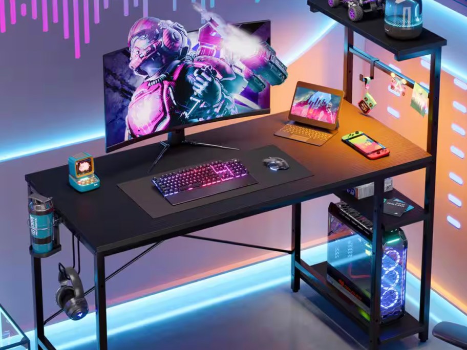 black gaming desk with onlineputer on top and lights 