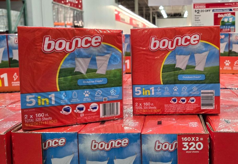 Two large boxes of bounce dryer sheets stacked on a pallet in a Costco warehouse