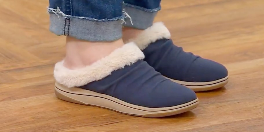 woman wearing blue clarks cloudsteppers 