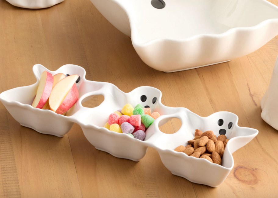 candy in white ghost trio serveware on wood table