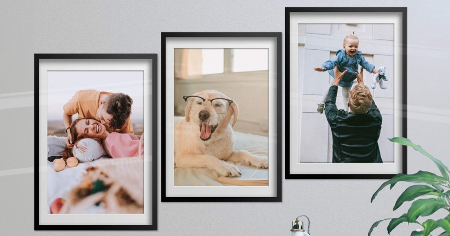 three cvs poster prints hanging in frames on wall