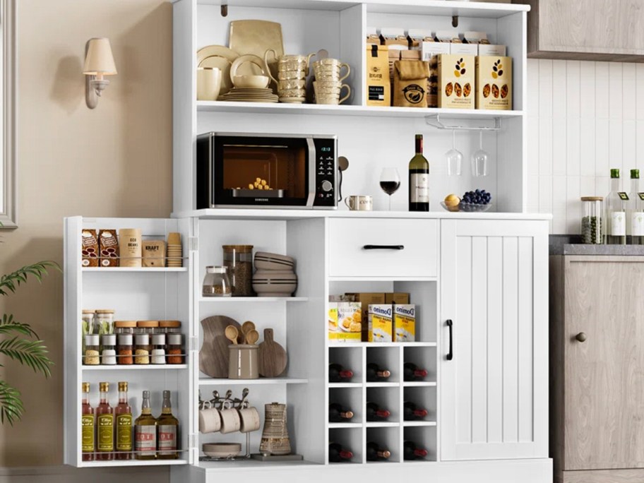 white cabinet full of pantry foods in kitchen