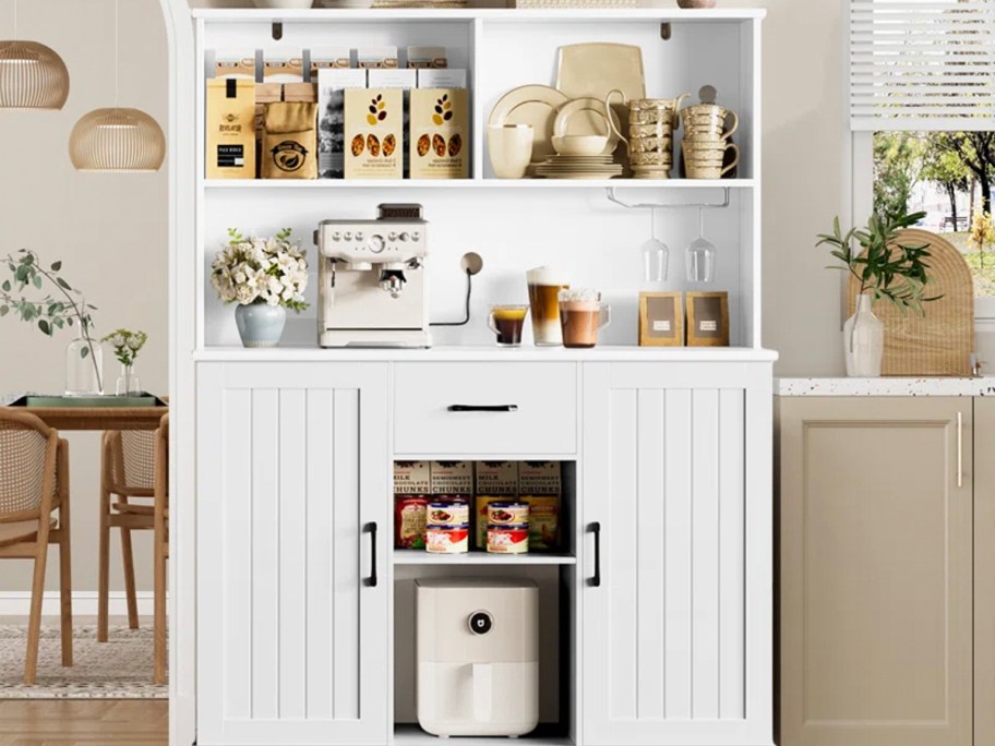 white cabinet full of food and kitchen gadgets 