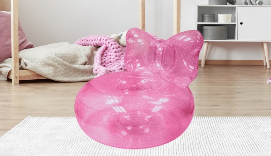 pink inflatable bow chair in girls room