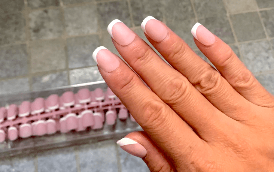 woman wearing french tip nails 