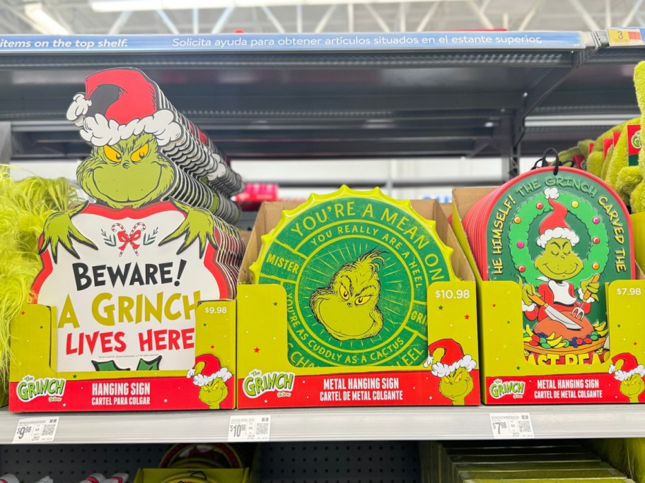 grinch hanging signs displayed at the store