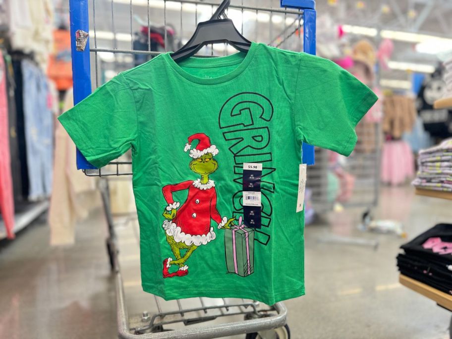 Dr. Seuss The Grinch Girls Graphic Short Sleeve T-Shirt hanging in store