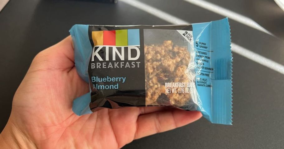 hand holding kind bar