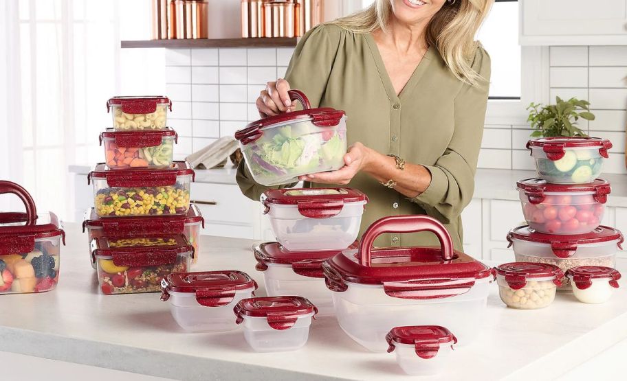 a woman in a kitchen displaying a set of lock n lock nestable storage containers