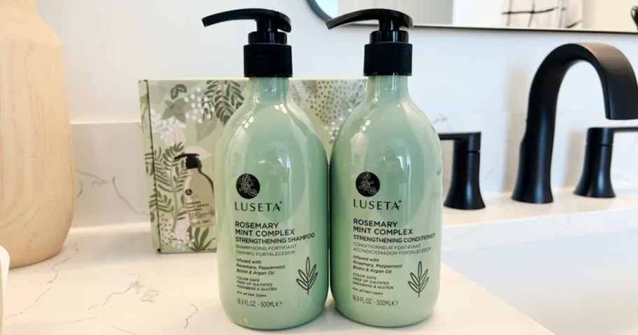 Luseta Rosemary Mint SHampoo & Conditioner Bottles on bathroom counter