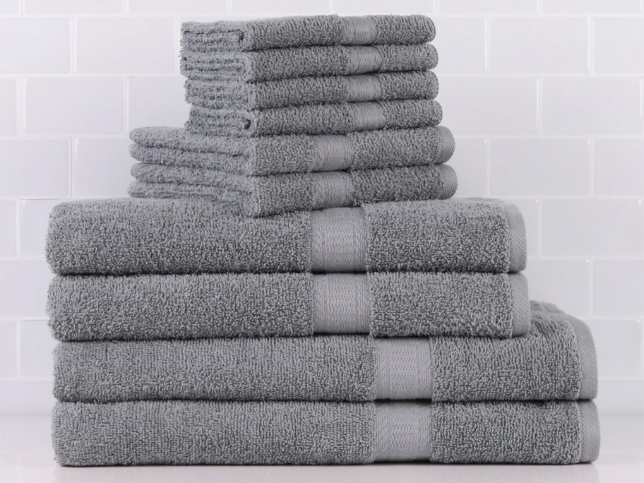 dark gray mainstays towels stacked in pile on countertop