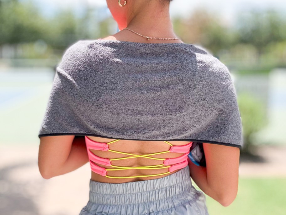 woman wearing cooling towel over shoulders and back