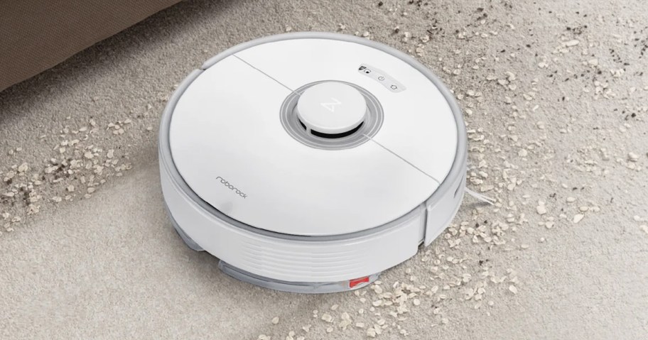 white roborock vacuum cleaning carpet