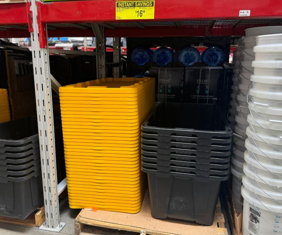 a stack of storage totes and lids on a store shelf at Sams