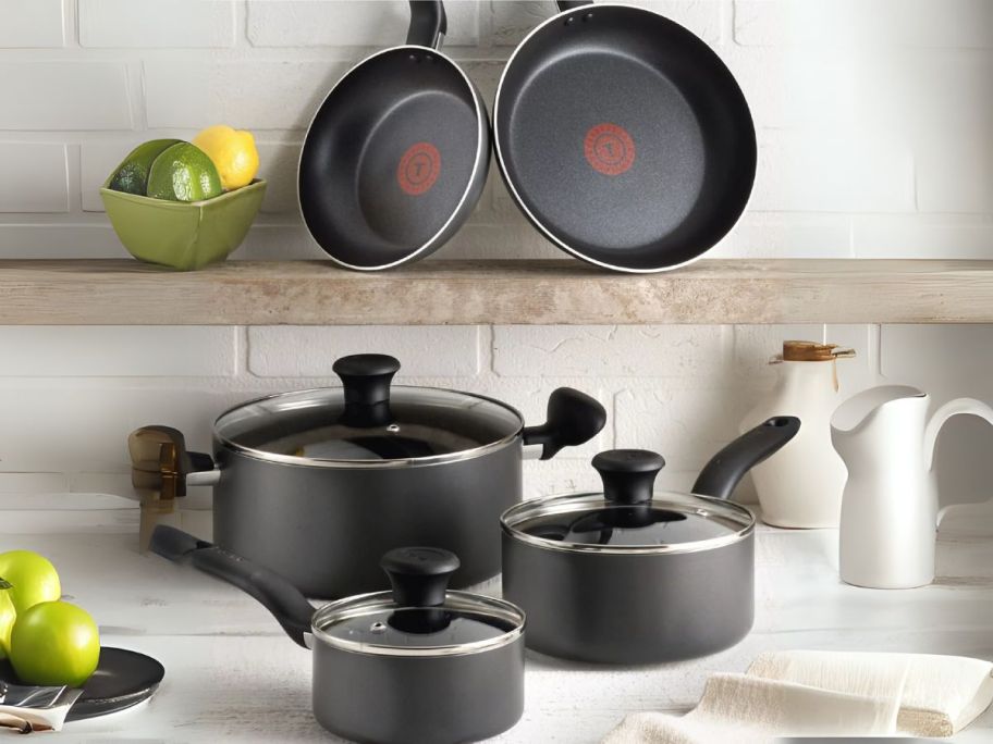 black T-Fal Initiatives Aluminum Nonstick Cookware Set on kitchen counter