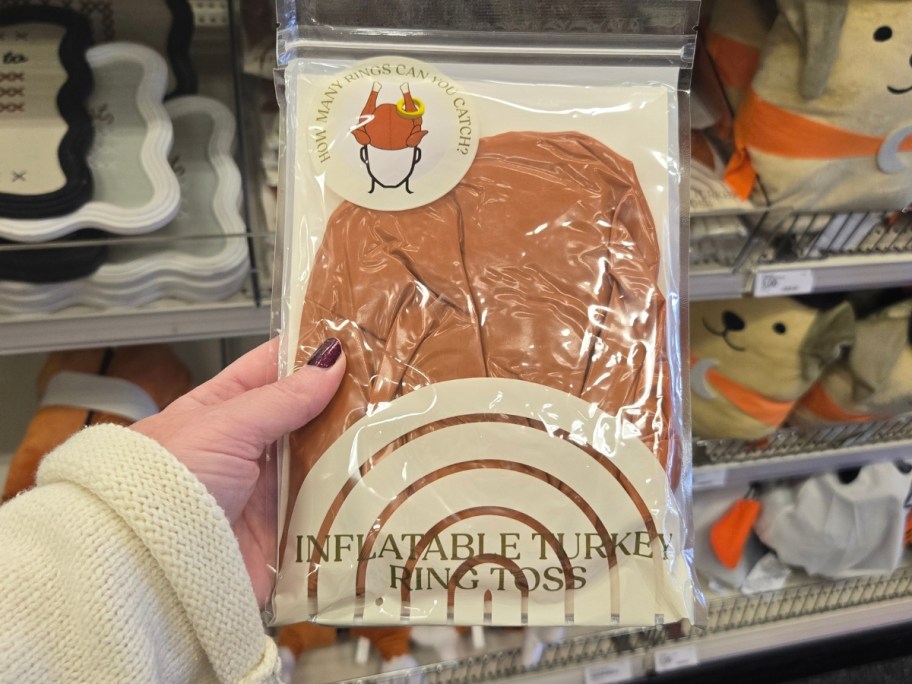 hand holding an Inflatable Turkey Ring Toss Game