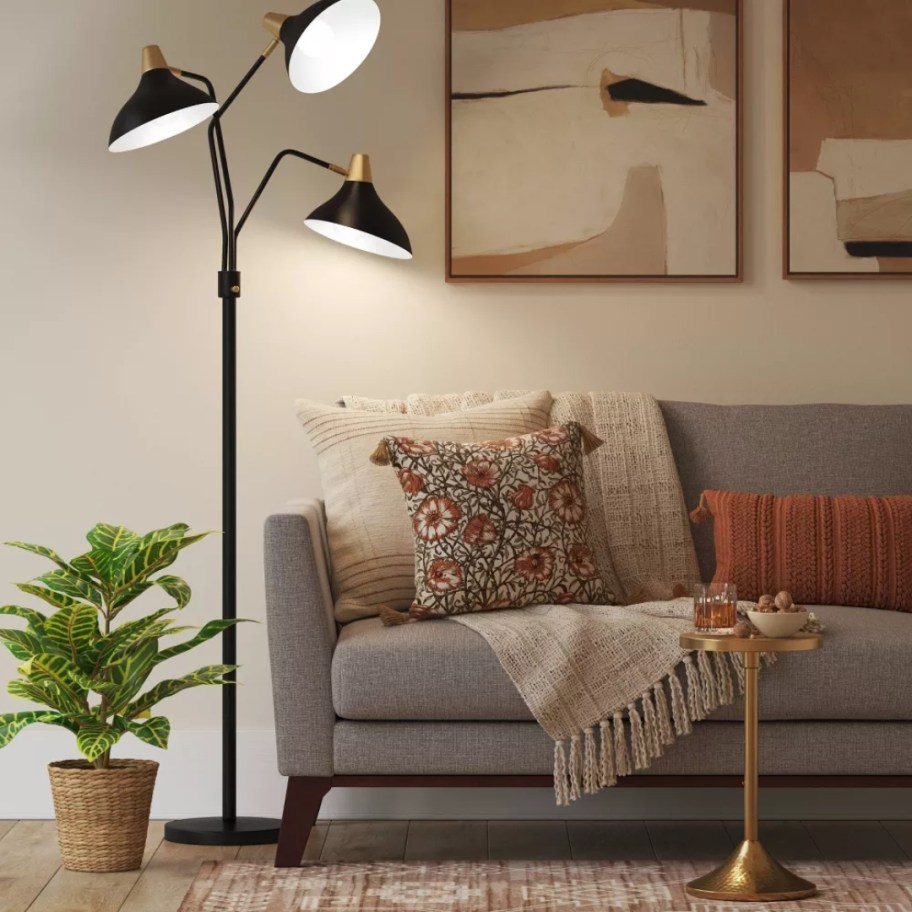 black 3 head floor lamp in a living room