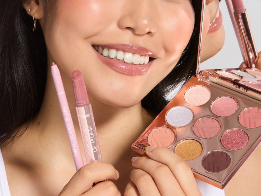 woman posing with tarte makeup