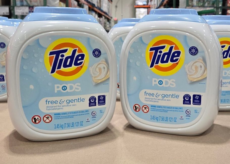  two containers of tide detergent pods stacked on a pallet in a Costco warehouse 