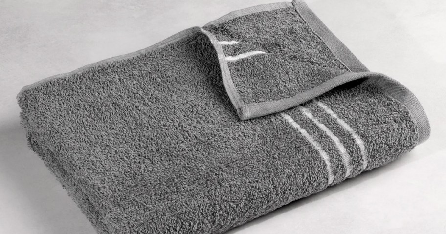 gray towel with white stripes folded