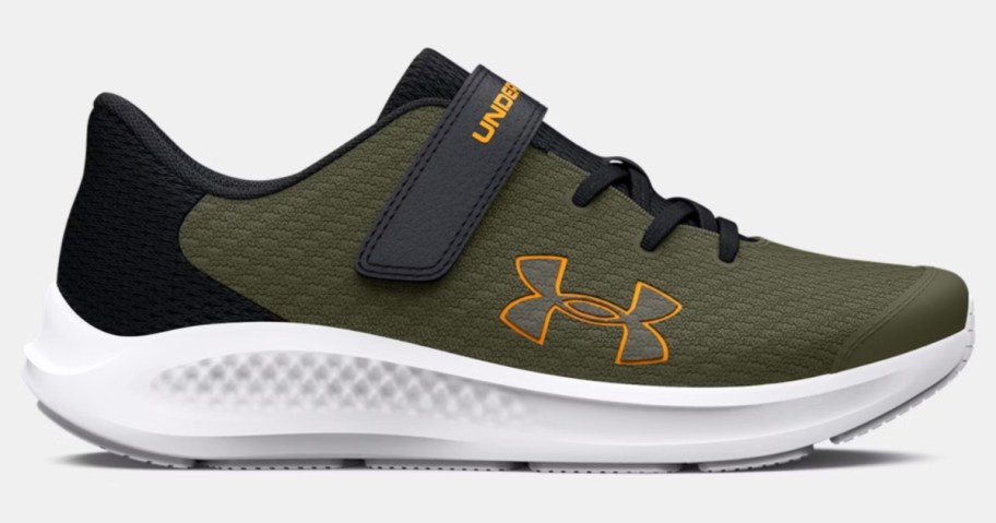 an olive green, white, navy and orange boy's Under Armour running shoe