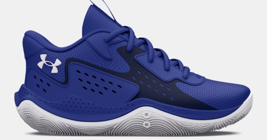 a blue and white Under Armour kids basketball shoe