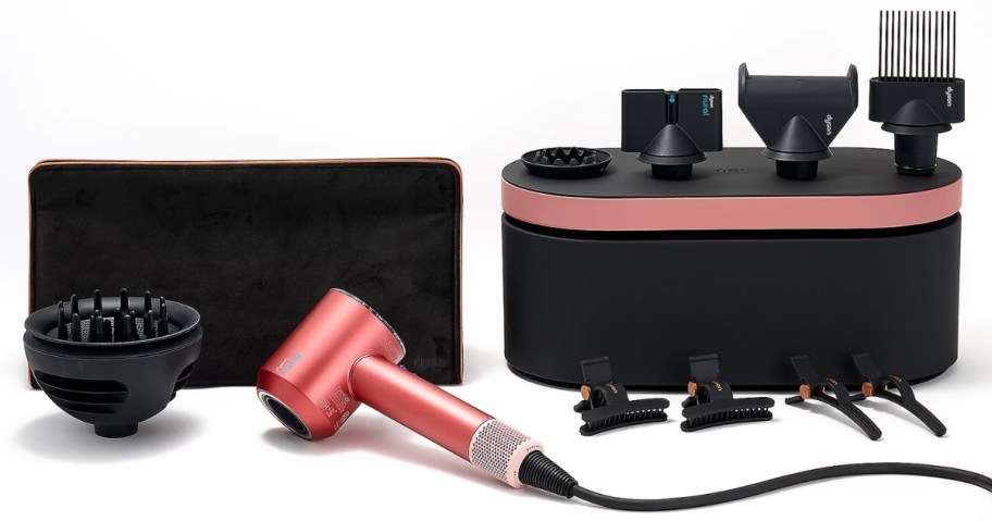 a pink Dyson Supersonic Nural Hair Dryer with Accessories