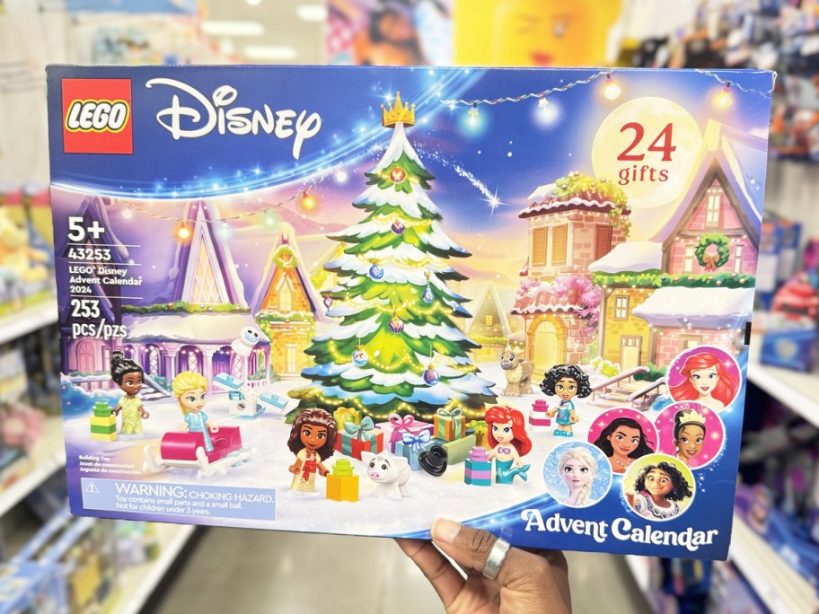 hand holding up 2024 LEGO Disney Advent Calendar in store