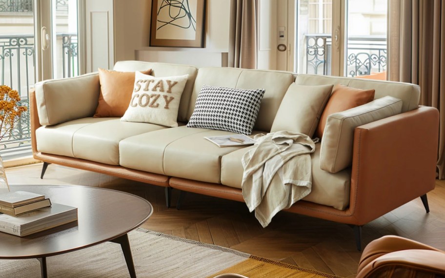 warm brown tone living room with leather and beige sofa