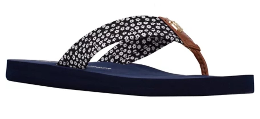 blue flip flop with flower details on the straps