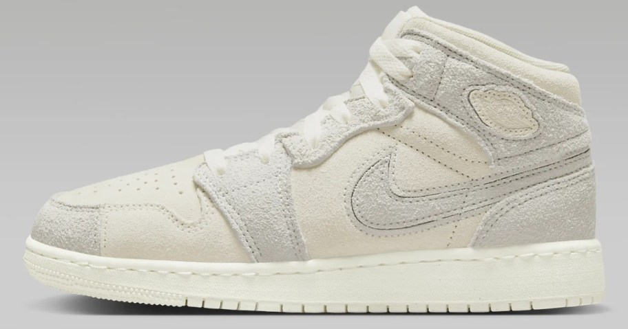 light grey and white kid's Air Jordan 1 mid top shoe