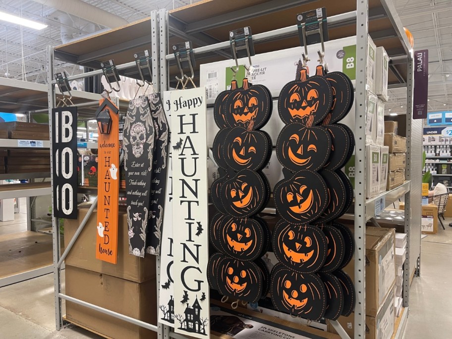 Halloween porch leaners and signs on a display in store